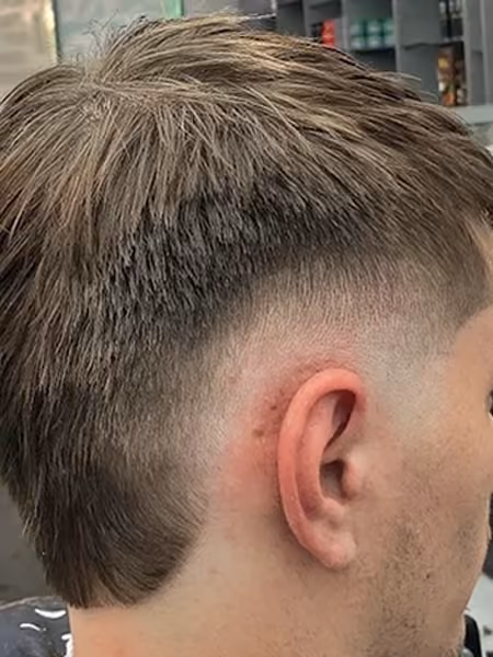 Modern Mod Mullet & Curved Ear Fade - Straight textured mod fringe with clean curved ear fade graduation down into a soft mullet taper.